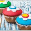Wallario Schneidebrett Bunte Muffins - alter Holztisch - Stillleben
